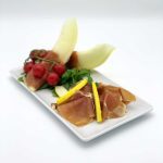 Honigmelone mit luftgetrocknetem spanischem Schinken